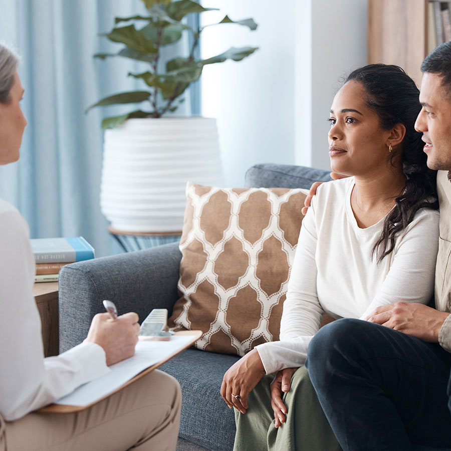 Young couple discuss the future with a SSAS administrator Young couple discuss the future with a SSAS administrator